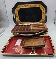 All items stacked showing variety of trays and trivets