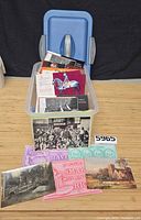 Front view of bin with postcards displayed at front and lot number visible