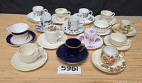 Group shot of all fourteen teacup and saucer sets