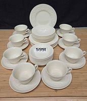 Full set arranged showing cups, saucers, plates, bowls