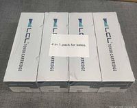 Front view of four sealed LCL toner cartridge boxes