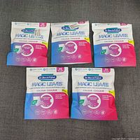 Front view of five sealed packs showing branding and quantity