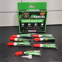 Front of retail box and seven tubes displayed
