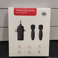 Front of retail box showing receiver and two transmitters, Wireless Microphone branding and 2.4 G icon