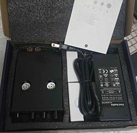 Amplifier, power adapter, AC cord and boxed tubes inside original packaging