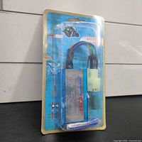 Front view of factory-sealed CDI ignition box in blister package