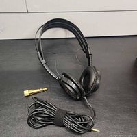 Headphones, adapter, and cord overview