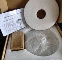 Box contents: bubble-wrapped solar panel unit, small box of parts, foam protector, instruction manual