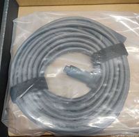 Coiled 10-meter Starlink Mini DC power cable sealed in plastic inside box