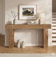 Framed print displayed on wall above console table