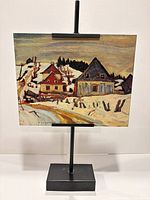 Front view on stand showing full artwork