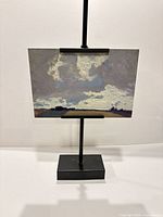 Front view of lithograph on display stand