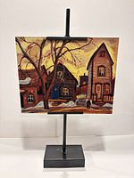 Front view on display stand showing full artwork