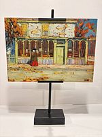 Front view of textured lithograph panel on stand