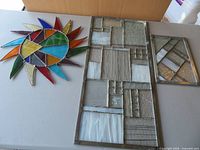 overview of all three stained glass pieces on table