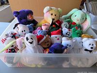 Top view of clear bin filled with assorted Ty Beanie Babies and Buddies