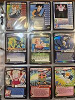 Binder page showing nine Dragon Ball Z TCG cards in sleeves