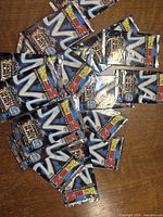 Pile of multiple sealed Dragon Ball Z Senzu Blast booster packs