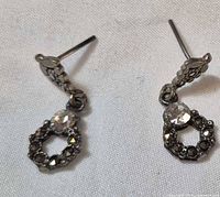 Both earrings front view on white background