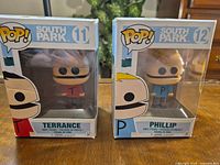 Front view of both boxed figures showing characters and numbering