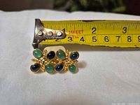 front view showing cluster design and tape for scale