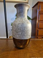 Front view of vase showing gray marbled upper and bronze lower sections