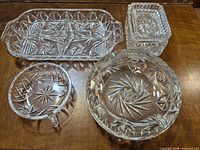 Group overview of five crystal dishes showing sizes and patterns