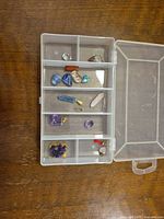 Overview of all gemstones and pendants in plastic case