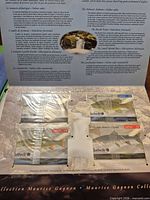 Fold-out display board showing wildlife themed QuebecTel/Telus cards in plastic sleeves