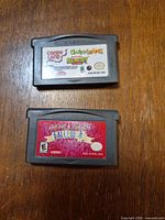 Front view of both GBA cartridges showing titles and label wear