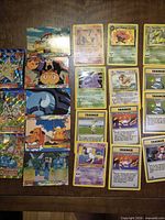 Selection of Pokémon TCG and Topps foil anime cards showing variety and condition