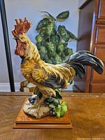 front view showing full rooster and wood base
