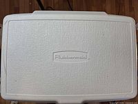Top view showing embossed Rubbermaid logo on white lid