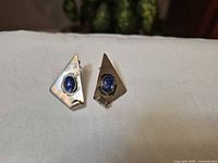 Front view of both earrings showing gemstone and silver shape