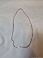 Entire chain laid flat showing full length and style