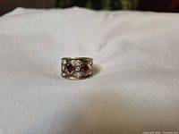 front view showing red square stones and clear rhinestones