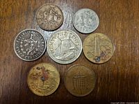Overview of all seven coins obverse sides