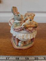 Full view of resin trinket box showing bear, rabbit, puppy and buggy