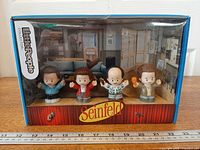 Front view of boxed Little People Seinfeld set showing four figures