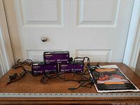 Three boxed 40-count curtain mini light sets with cords displayed and sealed package of Stuff-A-Pumpkin leaf bags