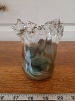 Front view showing vase form, swirled interior and height reference