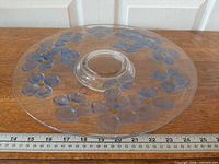 Top view of round footed platter showing Blue Dogwood floral motif