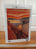 Front view of sealed puzzle box showing artwork, piece count, brand logo