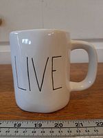 Front view showing “LIVE” text and overall shape