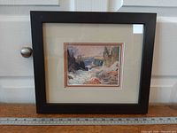 Entire framed print front view with ruler for scale