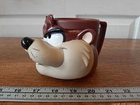 Left side profile of Tasmanian Devil plastic mug with ruler for scale