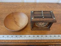 Coaster caddy and wooden bowl beside ruler for scale