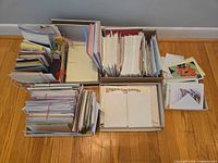 overview of multiple boxes filled with greeting and note cards plus envelopes