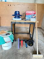 Full lot showing polisher on stand with bucket, scrapers, squeegee and other accessories