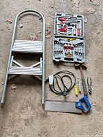 Overview showing ladder, tool kit, and assorted tools laid out